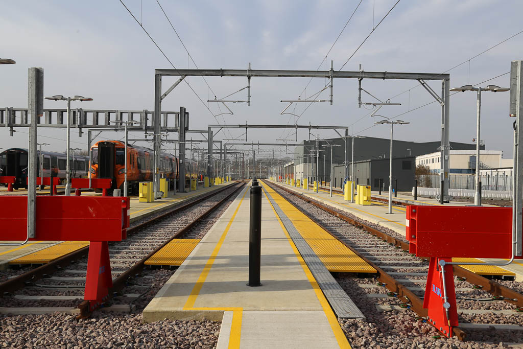 Train platform showing overhead electrical cabling